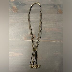 Long black and gold beaded necklace